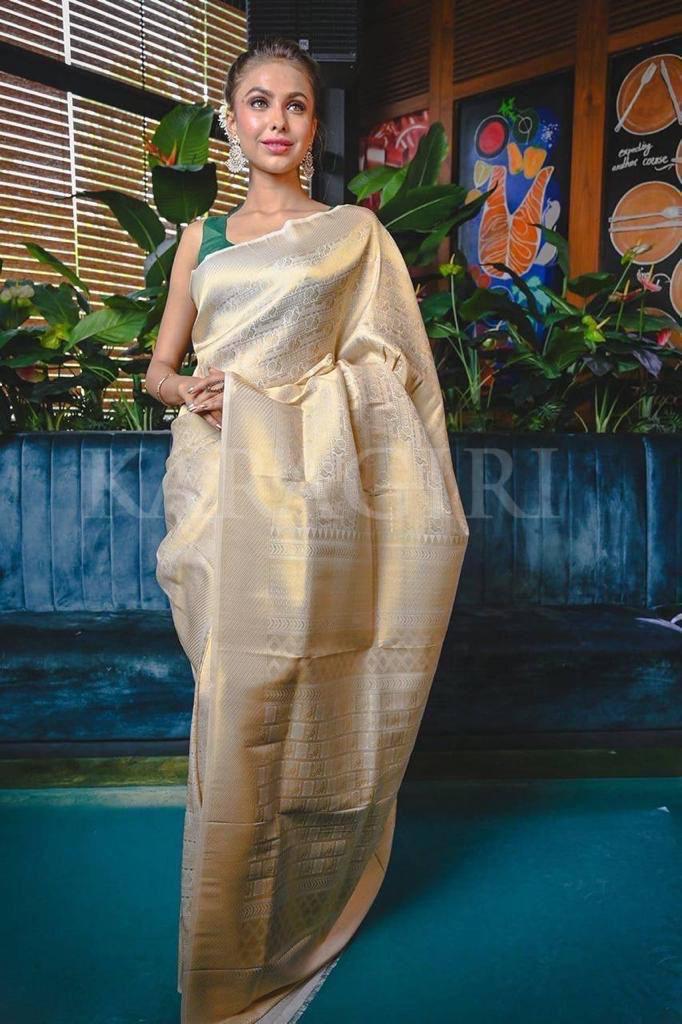 Demesne Beige Soft Banarasi Silk Saree With Demure Blouse Piece