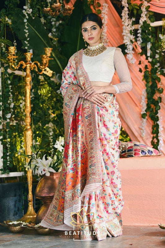 Stylish Cream Banarasi Silk Saree With Gleaming Blouse Piece