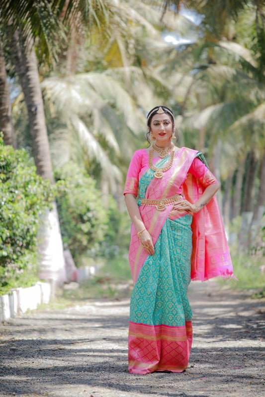 Gratifying Firozi Banarasi Silk Saree With Engrossing Blouse Piece