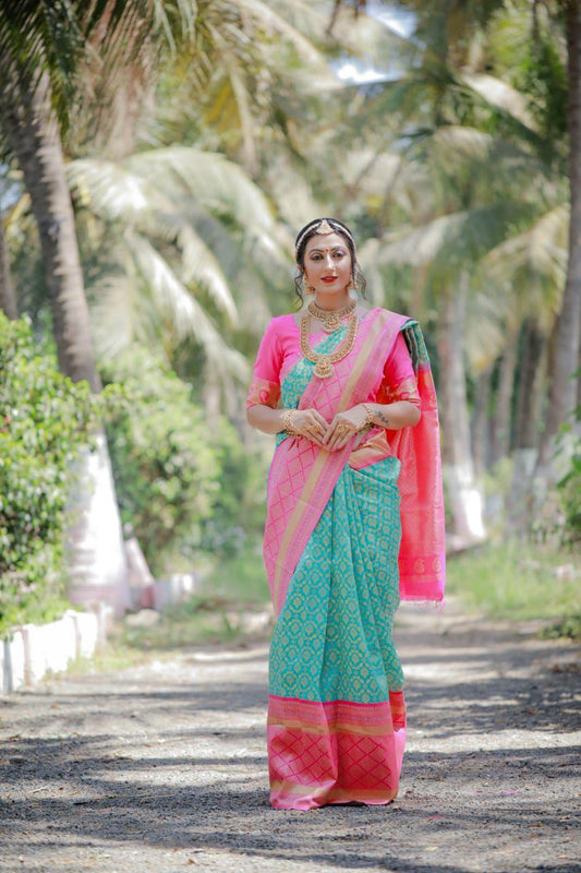 Gratifying Firozi Banarasi Silk Saree With Engrossing Blouse Piece