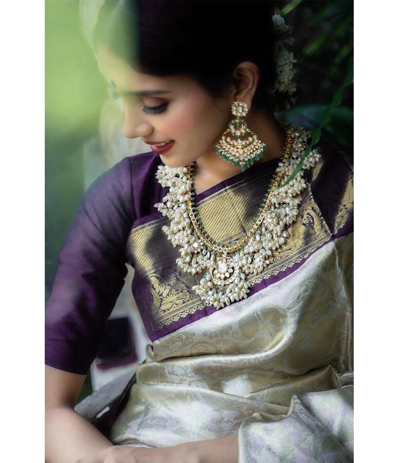 A glam Beige And Purple Soft Silk Saree With Groovy Blouse Piece