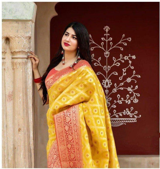 Adorning Yellow Soft Banarasi Silk Saree With Flattering Blouse Piece