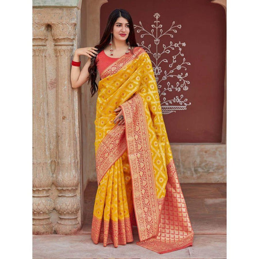 Adorning Yellow Soft Banarasi Silk Saree With Flattering Blouse Piece